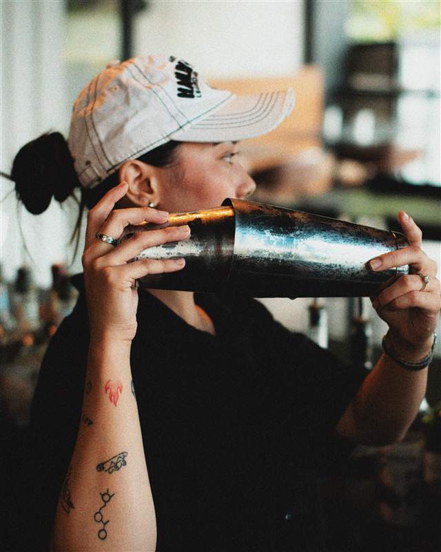 Bartender shaking a cocktail at Afterhours