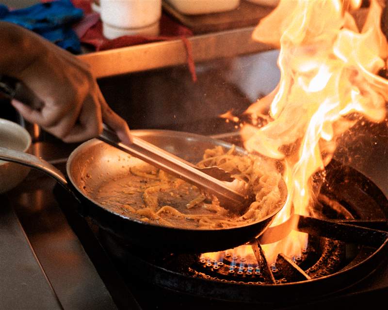 Pasta being flambeed at Afterhours