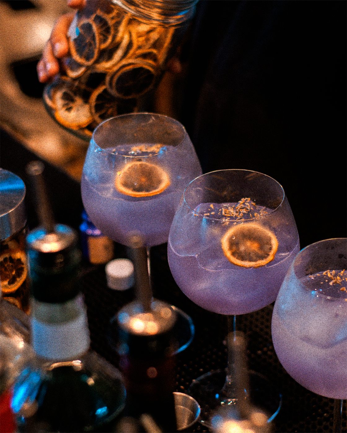 A purple mocktail with dried citrus at Afterhours